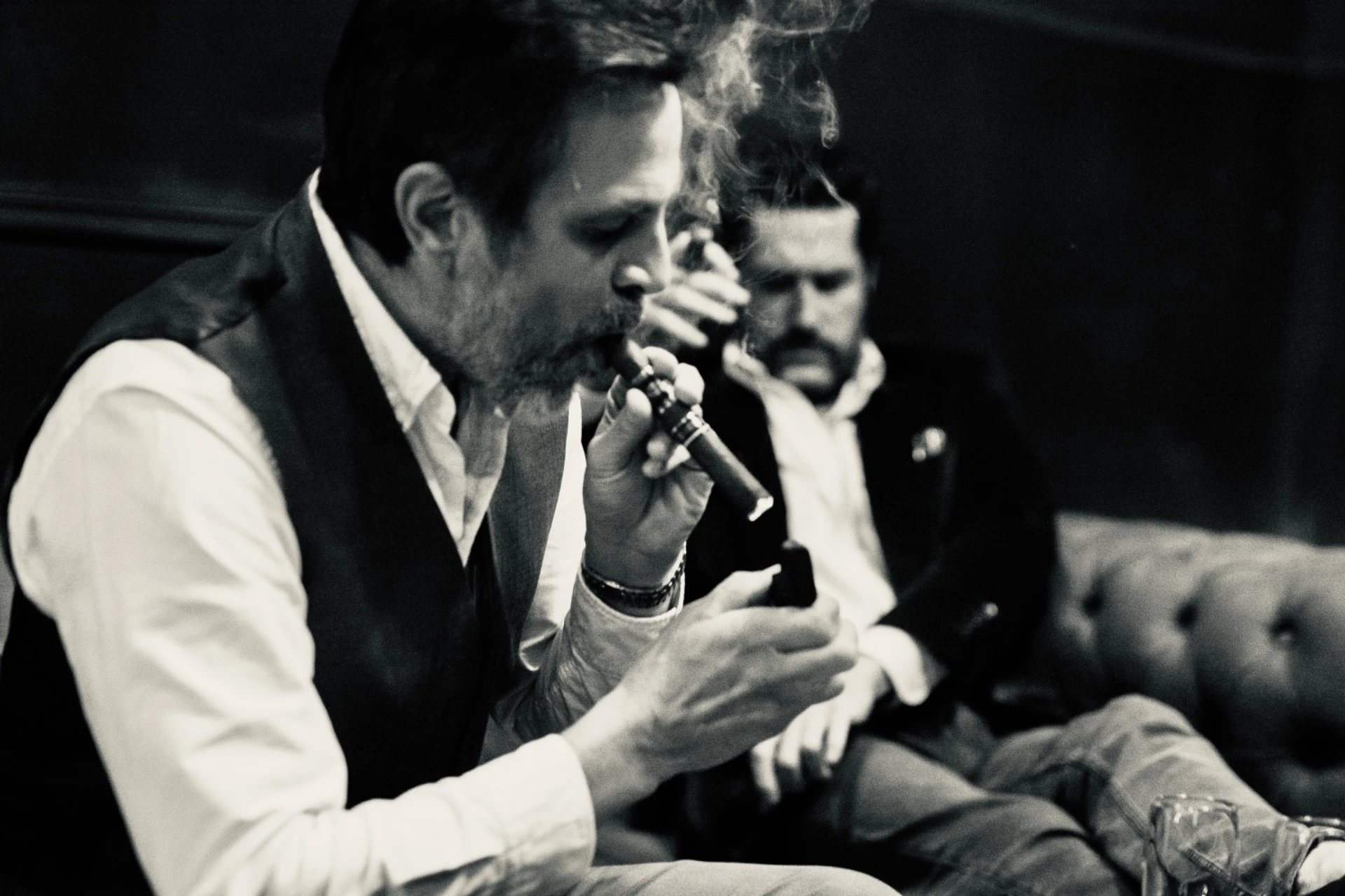 Cigar lounge, lighting a cigar